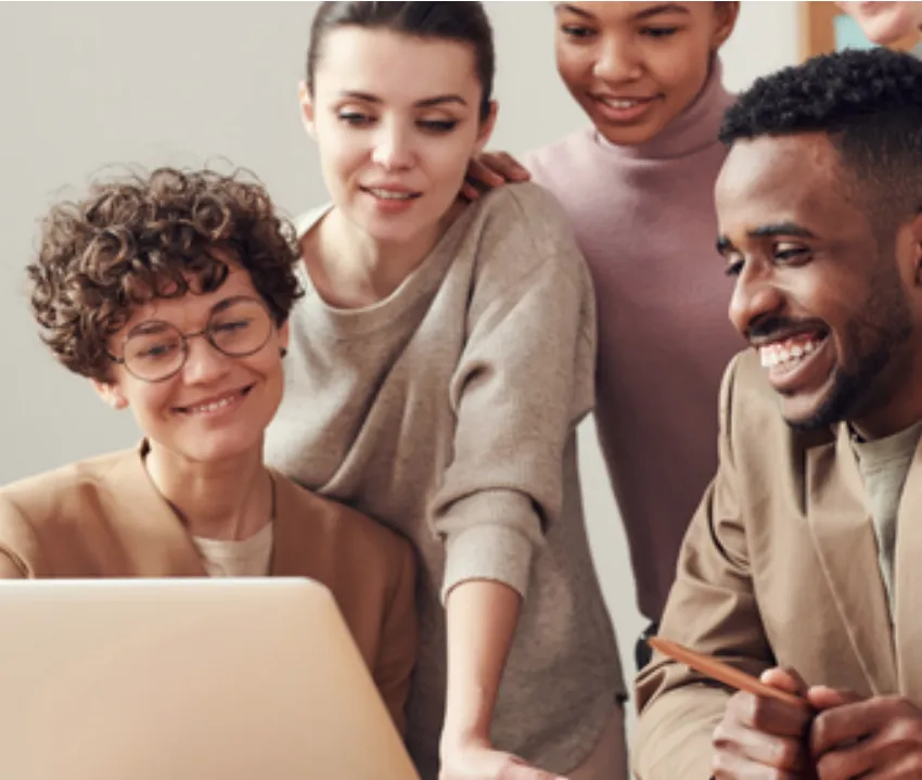 People looking at a laptop together